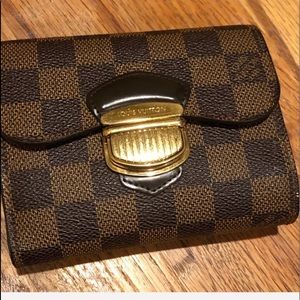 Louis Vuitton compact wallet.